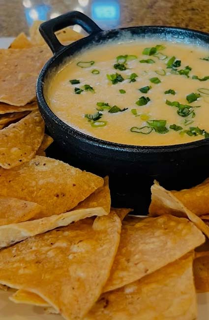 Enjoy classic Mexican food: cheese dip with green onions at Mi Guadalajara Restaurant, Escondido.