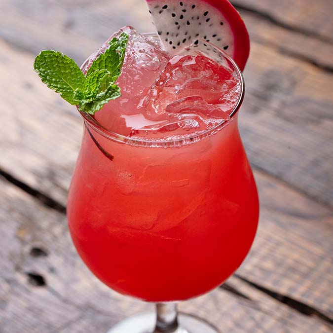 A refreshing red drink with dragon fruit, perfect for pairing with tacos in Escondido.