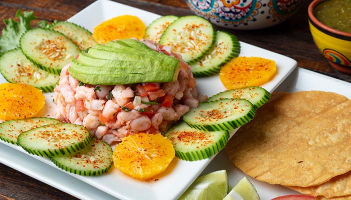 Mexican Food favorite in Escondido: shrimp ceviche topped with avocado, cucumber, and orange.