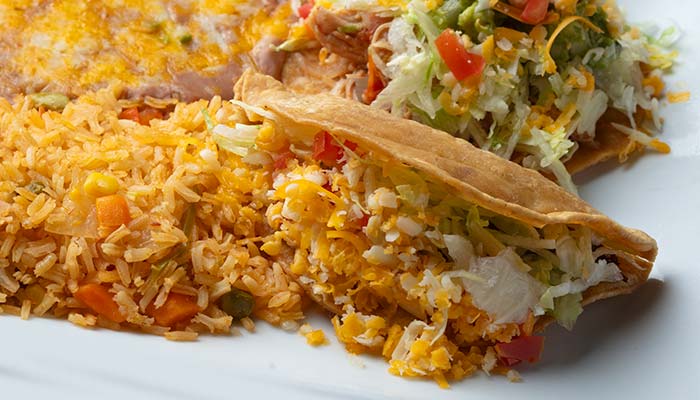 Enjoy two crispy tacos, classic Mexican food with beans and rice, served Escondido-style.